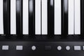 Piano or electronic synthesizer piano keyboard background Midi keyboard and controller with faders and buttons. Concept of close