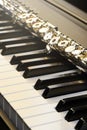 Piano and flute with golden shine and sheet music. Horizontal Composition.Front view Royalty Free Stock Photo