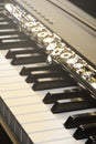 Piano and flute with golden shine and sheet music. Horizontal Composition.Front view Royalty Free Stock Photo