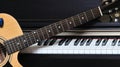 Piano key and guitar. Royalty Free Stock Photo