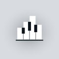 Piano keyboard icon with abstract buildings symbol