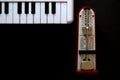 Piano keyboard and a metronome