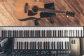 Piano keys and acoustic guitar, top view. Royalty Free Stock Photo