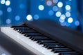 Piano keys on a blue bokeh background