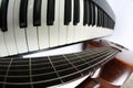 Piano keys and classical guitar close up on white background Royalty Free Stock Photo