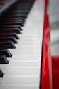 Piano keys close up. Red piano. Music and sound concept. Concert musical instrument. Performance concept. Black and white keys. Royalty Free Stock Photo