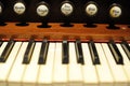 Piano keys or keyboard of old, historic clavichord or harpsichord. Close-up photo with selective focus and shallow depth of field