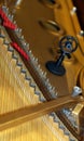 Piano with little hammer and strings and microphone