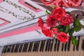 Piano with red roses