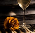 Piano with rose on the keys and wine