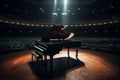 A piano set up on the stage of a concert hall with rows of seats