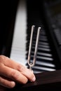 Piano and tuning fork Royalty Free Stock Photo