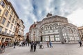 Piazza del Duomo in Florence, baptistery of San Giovanni with many tourists visiting.