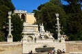 Piazza del Popolo with the Fontana della Dea di Roma, looking up at the Baclonata del Pincio in Rome, Italy Royalty Free Stock Photo