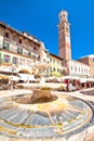 Piazza delle erbe in Verona street and market view with Lamberti tower Royalty Free Stock Photo