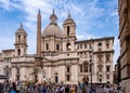 Piazza Navona square with Sant`Agnese in Agone church and Four Rivers Fountain in historic city center of Rome in Italy