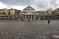 Piazza Plebiscite with colonnade and dome in cloudy day. Naples landmark. Italian architecture.