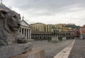 Lion statue closeup in front of cathedral at Plebiscito square, Naples. Italian architecture concept.