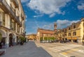 Piazza Risorgimento with historic buildings and Cathedral in Saluzzo, Italy