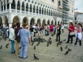 Venice San Marco square tourist feed birds