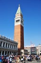 Piazza San Marco in Venice. View of the bell tower Campanile and tourists in the square.