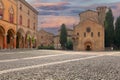 Piazza Santo Stefano. View of the facade of basilica and people walking or standing in the square. Italian summer atmosphere