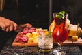 Picada table and two cocktail glasses on a black marble surface Royalty Free Stock Photo