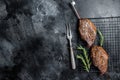 Picanha, traditional Brazilian barbecue, grilled beef meat steak. Black background. Top view. Copy space Royalty Free Stock Photo