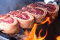 Picanha. Traditional Steak beef in Brazilian barbecue with fire background