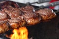 Picanha. Traditional Steak beef in Brazilian barbecue with fire background.