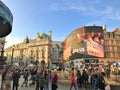 Piccadilly Circus with large crowd of people, London, UK