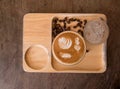 Piccolo Latte art in small glass on wooden desk