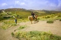 Pichincha, Ecuador September 18, 2017: Tourist riding a horse on the top of the Pichincha mountain with a panoramic view Royalty Free Stock Photo