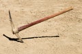 Pick Ax plunged into dirt ground