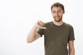 Pick me you would not regret choice. Portrait of ambitious energized good-looking male coworker in dark-green t-shirt