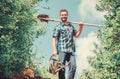 Pick out flats favorite plants. Gardening pro tips. Spring gardening. Man bearded hipster hold shovel and watering can