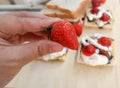 Pick strawberry or bread and canape with strawberry