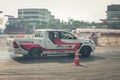 Pick-up car perform drifting on the track with motion blur Royalty Free Stock Photo