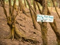 Pack your Poop sign in a forest near the beach in Hawaii Royalty Free Stock Photo