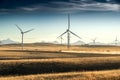 Pick up truck driving down a gravel road through a wind farm at sunset Royalty Free Stock Photo