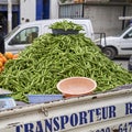 Pick-up truck with a mountain of beans on the truck bed is parked at the side of the road, waiting for bean buyers Royalty Free Stock Photo