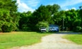 Pick-ups and an old wooden house. Rural Life in Texas, USA Royalty Free Stock Photo