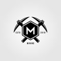 Pickaxe crosses over letter m hexagon vintage logo design illustration