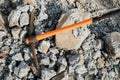 Pickaxe hoe lying on crushed stones. hand-held percussion tool designed for working on stone, stony ground, very dense ground