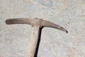 The pickaxe tool lies on the stone. Extraction of stone and iron ore equipment pickaxe with