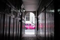 Pickering Place, London UK: narrow passageway leading to small square. At the far end taxi drives along St James Street.