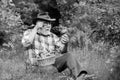 Picking mushrooms. Happy Grandfather with mushrooms in busket hunting mushroom. Grandfather with basket of mushrooms and Royalty Free Stock Photo