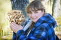 Picking mushrooms in the wild forest. Honey mushrooms. A girl is holding in her hand Royalty Free Stock Photo