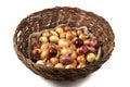 Picking onions of different varieties: yellow, red, pink, in a large basket on a bag, side view. Royalty Free Stock Photo