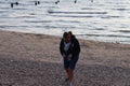 Picking shells from a beach